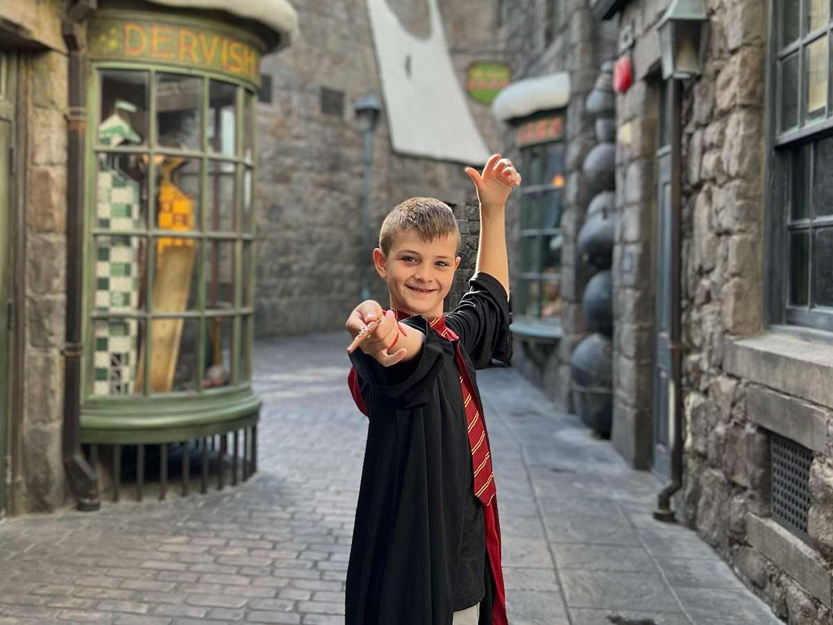 Wizarding World of Harry Potter wand in alleyway.
