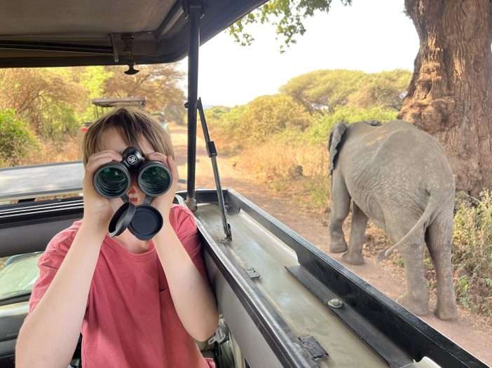 Tanzania safari with child and elephant in background