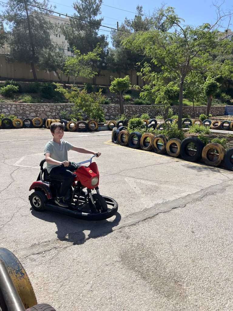 9 year old on go kart in sport city in Amman
