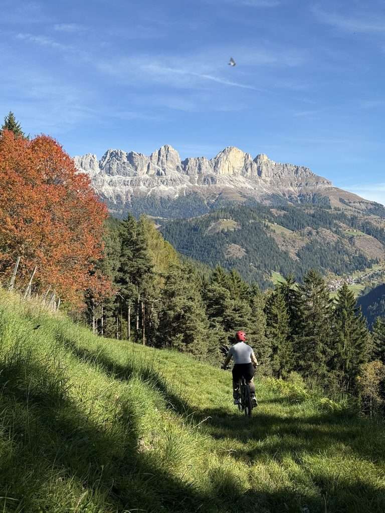 biking through farms in the dolomites