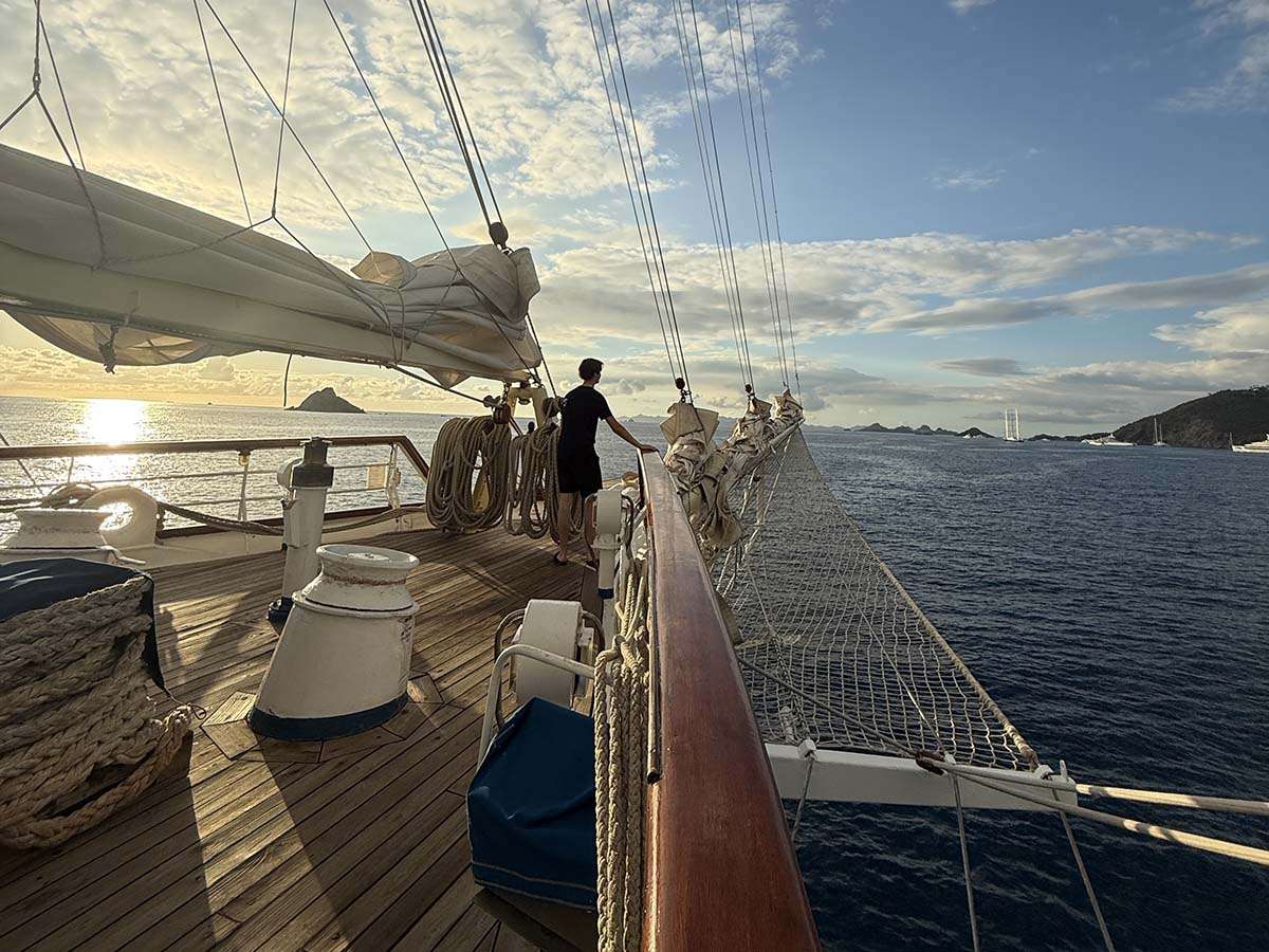 Star Clipper Sailing Vessel with teen on bow of ship