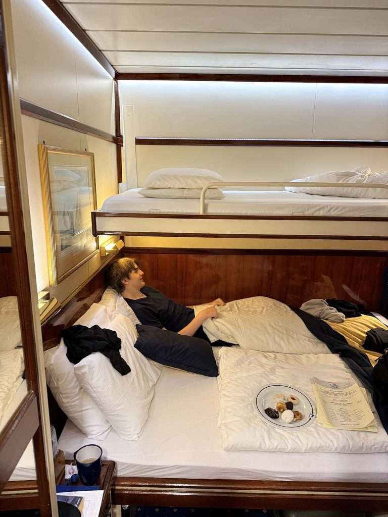 star clipper with third bunk down and person under the bunk