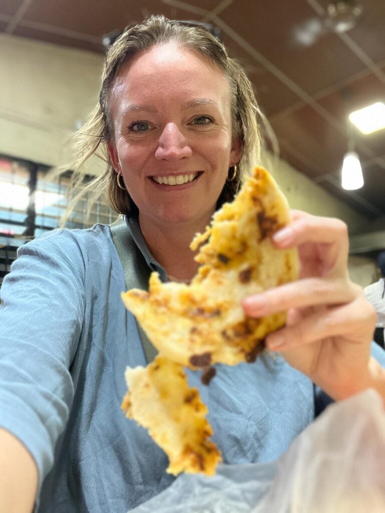 Lindsay eating first pupusa